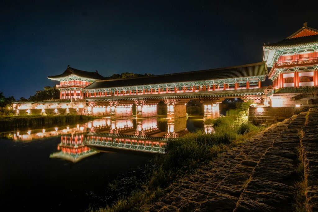 Illuminated Woljeonggyo Bridge reflected in the river at night in Gyeongju.