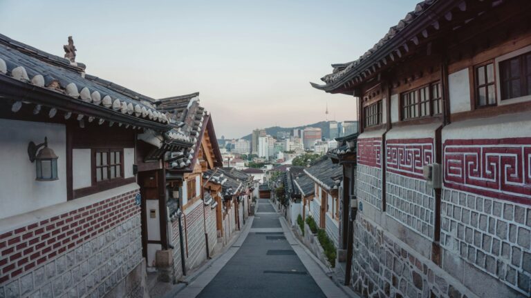 Traditional hanok houses along a quiet lane in Bukchon Hanok Village, Seoul.