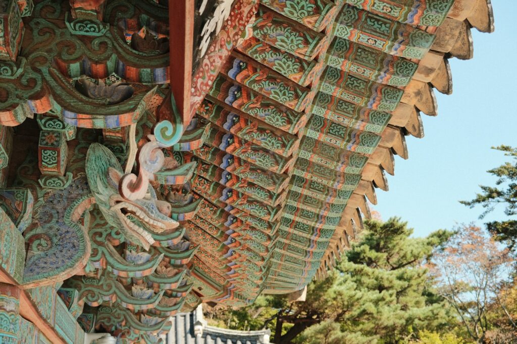 Painted wooden eaves and carved roof details at Bulguksa Temple in Gyeongju.