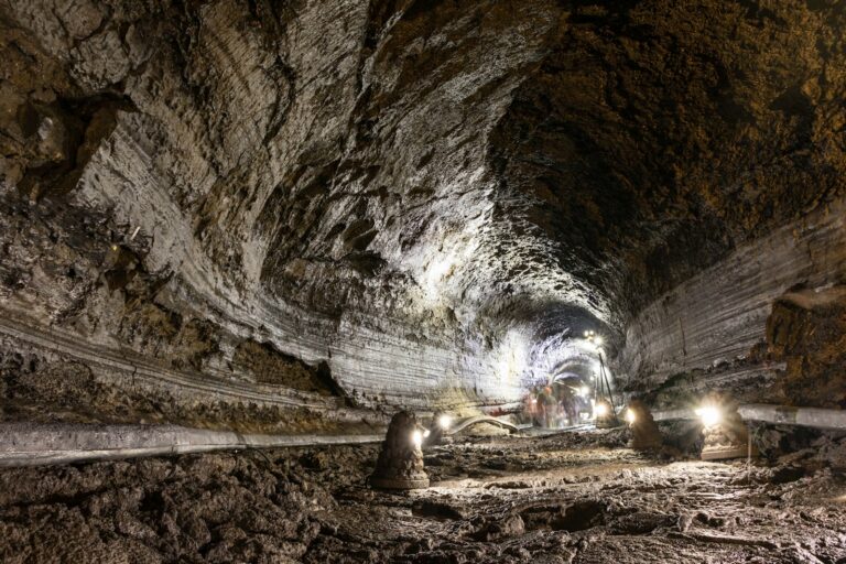 Manjanggul Lava Tube Illuminated rock walls and the visitor path inside Manjanggul Lava Tube, Jeju Island.