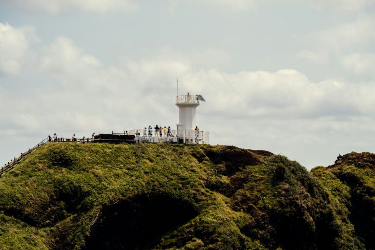 Seopjikoji Lighthouse The white lighthouse on the green Seopjikoji headland, Jeju Island.